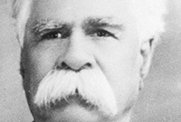 William Cooper protests a black and white portrait photo of a white-haired man with a white moustache