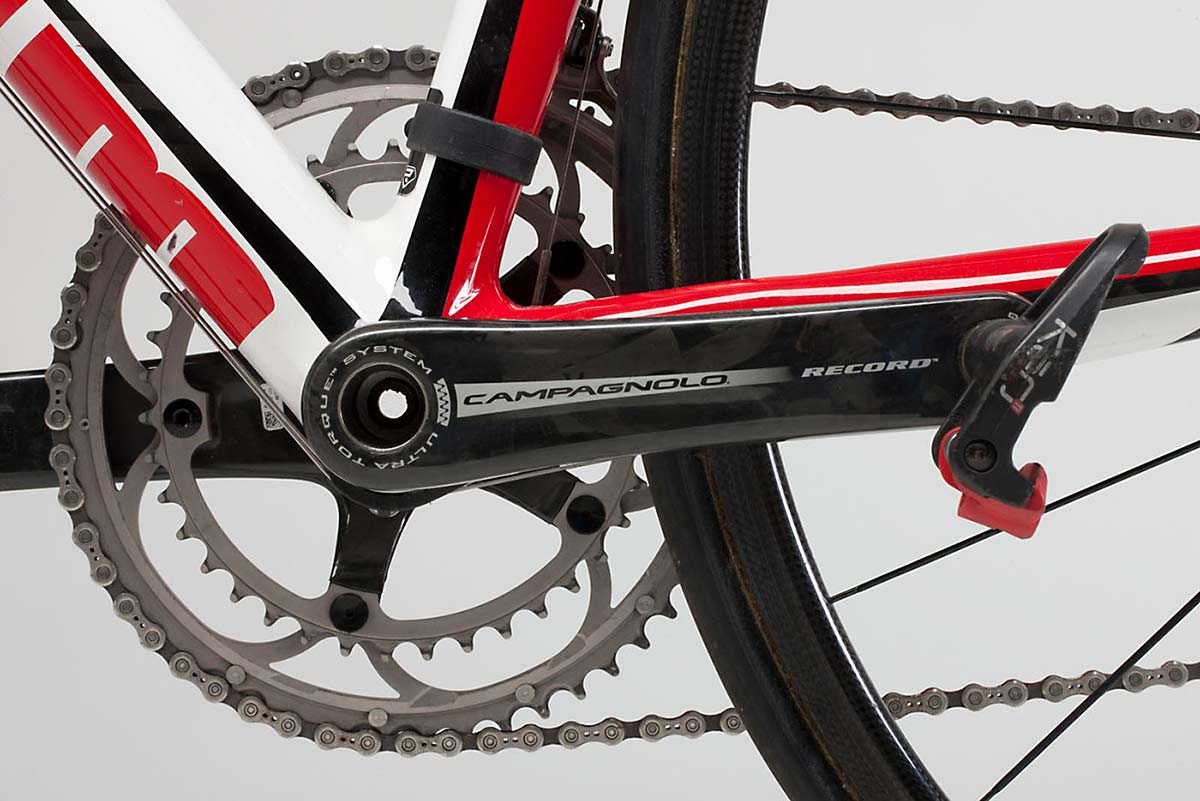 Detailed image of a crankset on a bike, with part of the rear wheel and a small section of the front tyre visible. - click to view larger image