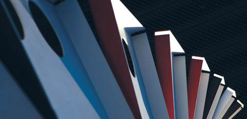Detailed architectural shot of an exterior feature of the National Museum. Concertined metal panels fan across the shot, with black, textured panels visible in the background.