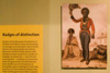 A display of breastplates and photographs