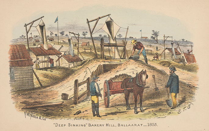 A series of huts with gerry-rigged frames from which are suspended what appear to be canvas chutes extending down into holes in the ground. In the foreground three men are working around a pony and cart, which is filled with soil.