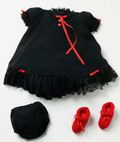 Child's black dress with red trim, black panties and red booties.