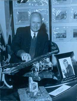 Bryne with his Southern Cross model and other components of the memorial
