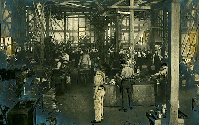 A photo of men at work inside the Sunshine Harvester Works.