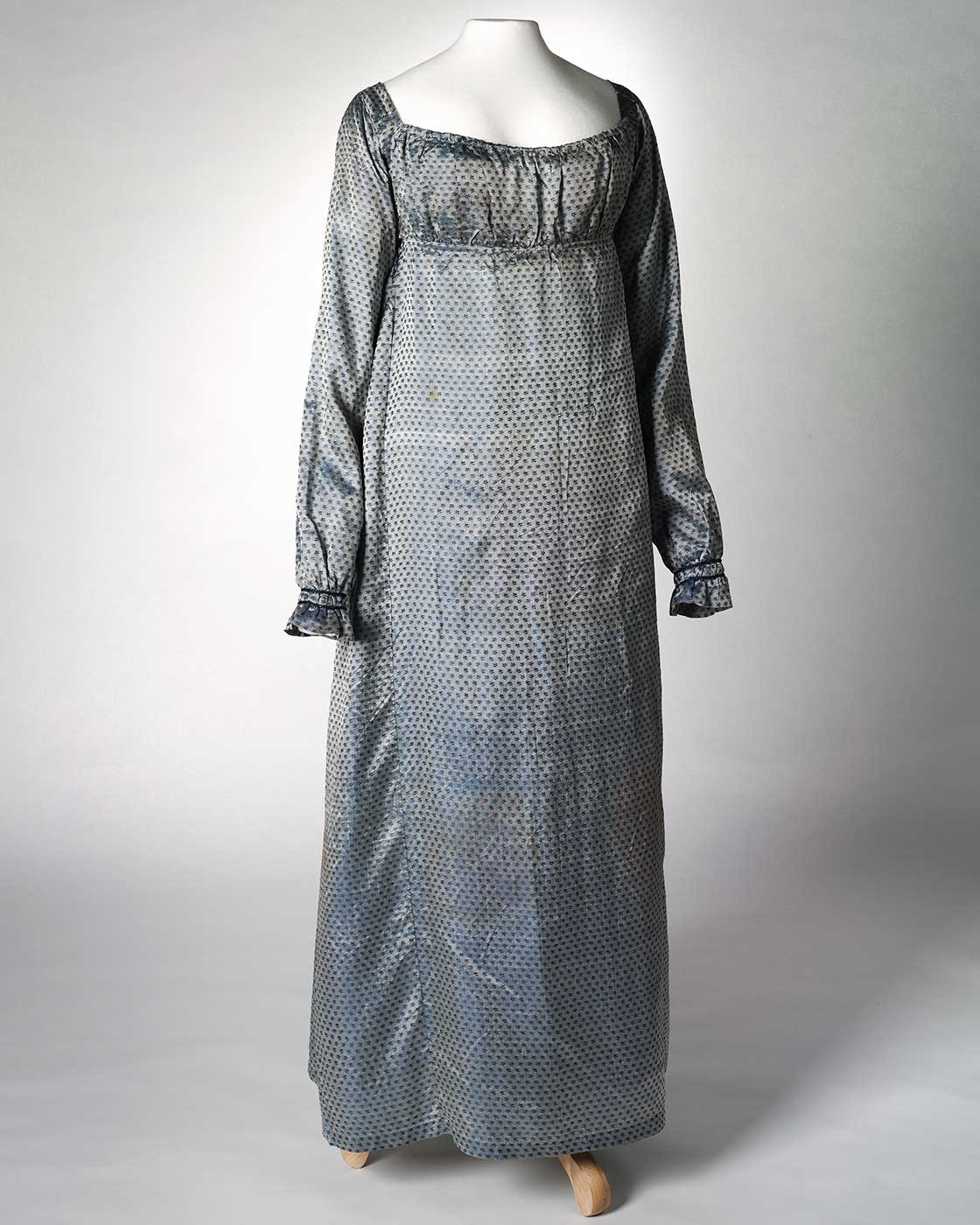 Front view of a blue silk full length empire-line dress. - click to view larger image