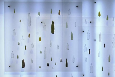 Display of Kimberley points in glass showcase.
