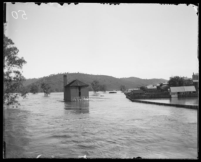a black and white photo of an outdoor flood scene