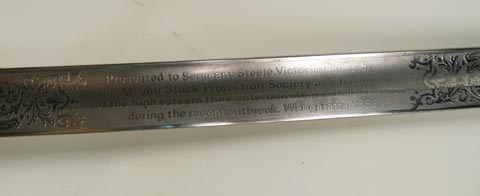 Close up of inscription on the sword.