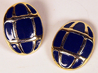 A pair of navy and gold earrings.