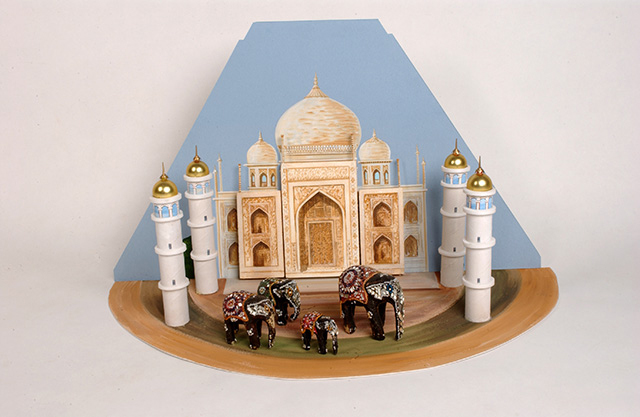A painted carboard and polystyrene diorama of the Taj Mahal, which includes four model elephants.