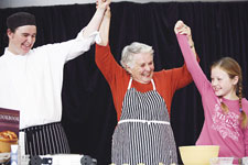 Chef Margaret Fulton with Brendan Gradidge from the Hyatt and Sydney visitor Lauren Clancy at the Anzac Biscuit Bash.