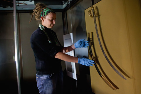 Installing Governor Lachlan Macquarie's sword in the Landmarks gallery.
