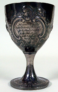 An engraved solid silver goblet.