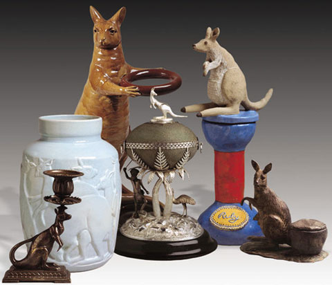 Collection of objects, from left: a brass kangaroo candestick; blue ceramic jug with kangaroo motifs; ceramic kangaroo umbrella stand; emu egg mounted in sterling silver and topped with a silver kangaroo; sculptured kangaroo atop a plinth with 'Ruby' at the base; a clay sculpture of a kangaroo.