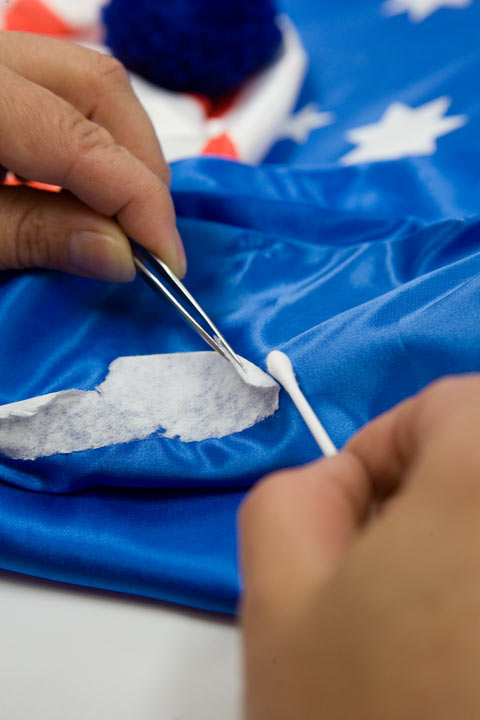 Mechanical removal of the double-sided tape assisted with solvent to release the adhesive.