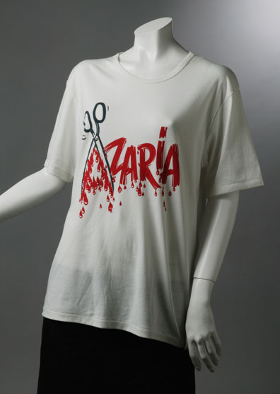 T-shirt with 'Azaria' written in red and the 'A' formed by an open pair of scissors.