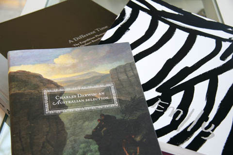 Stack of three books. The cover of 'Charles Darwin: An Australian Selection' is visible on top, with 'Emily' and 'A Different Time' partially visible below.