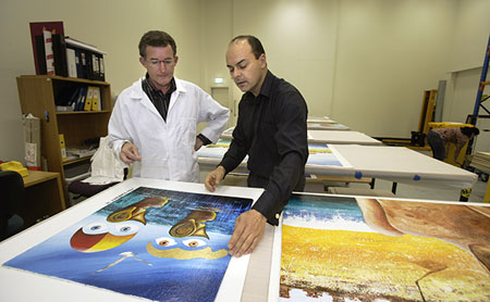 Conservation Manager Eric Archer describes the condition and proposed treatment of the gold painted area of this painting to the artist Paul Blahuta.