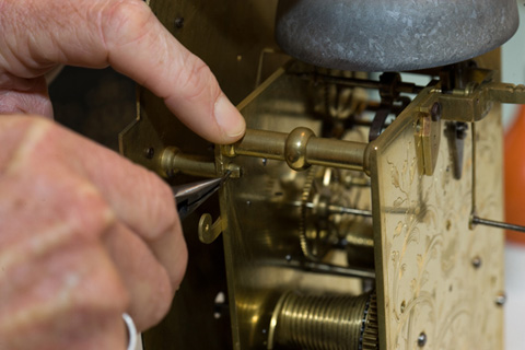 A small pin is positioned to the movement pillar to secure the dial.