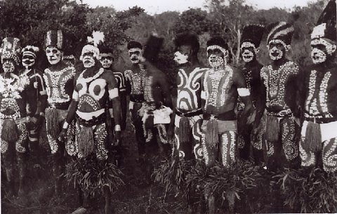 Ceremonial dancers decorated with paint and traditional costume, 1955.