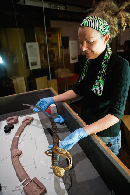 Installing Governor Lachlan Macquarie's sword in the Landmarks gallery.
