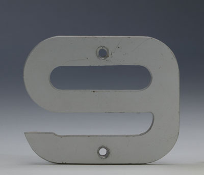 Number '9' with screw holes in top and bottom.