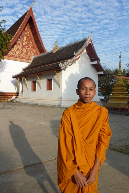 Monk Vanna standing in front of his temple prior to prayer time.