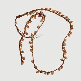 Necklace consisting of small red snail shells arranged onto a plaited string.