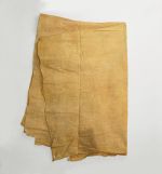 A piece of thin barkcloth dyed a yellow-brownish colour that also exhibits some reddish and greyish discolouration. Used as a cloak-like cape.