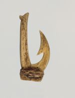 Fishhook, made of two pieces of bone bound together with a string made from plant materials. The barb is located on the inner side of the hook.