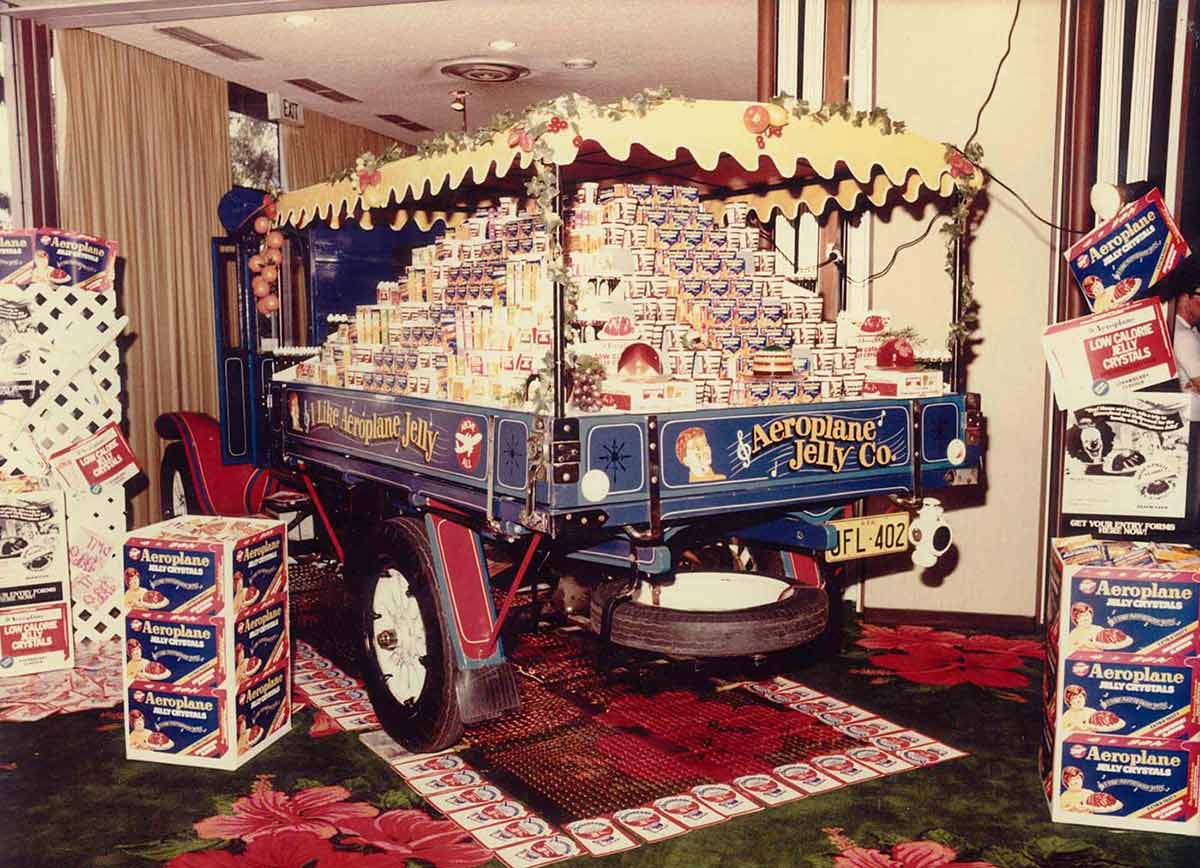 Rear view of a truck's tray, loaded with packets of jelly crystals.
