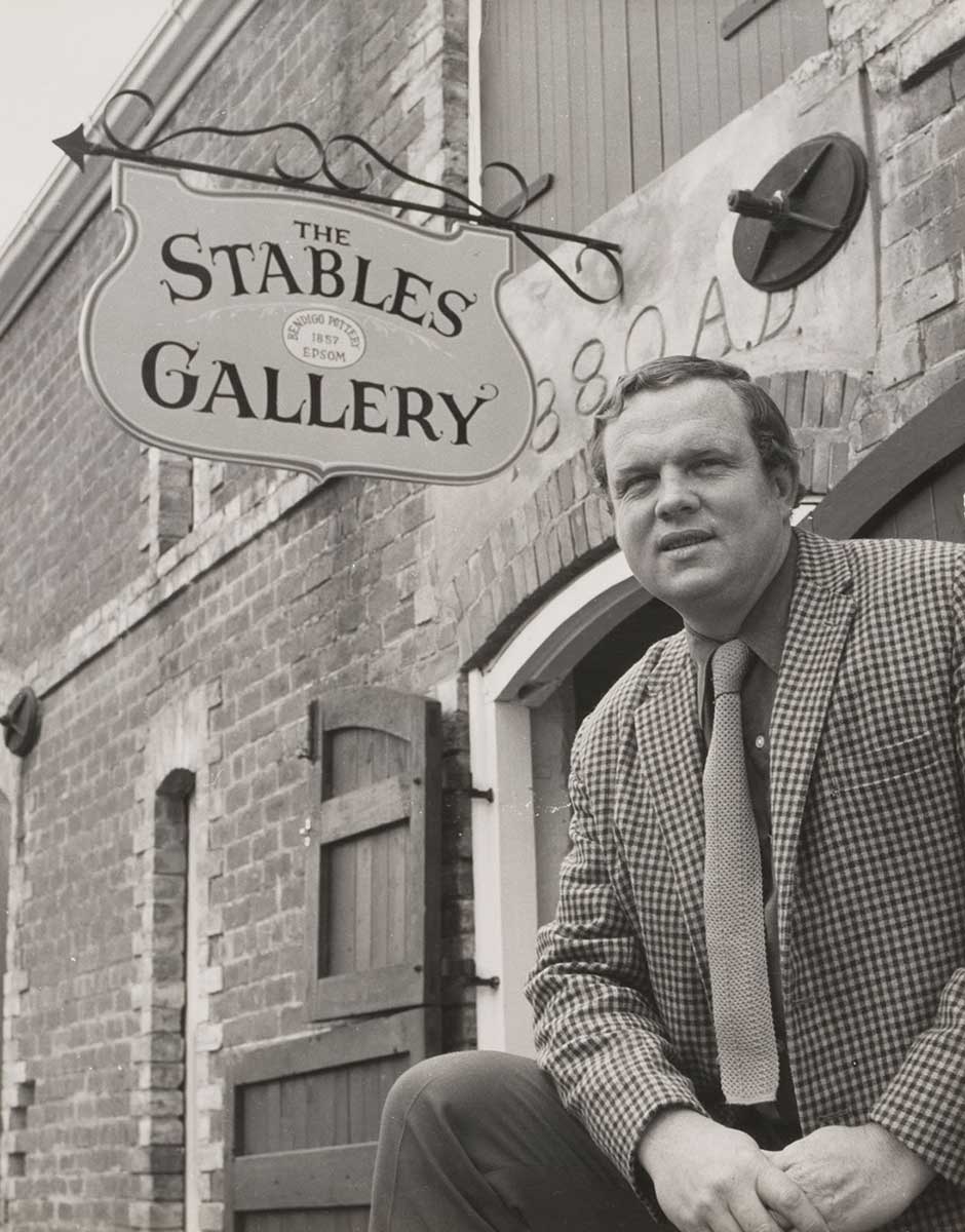 Photograph of Bill Derham in front of the Stables Gallery.