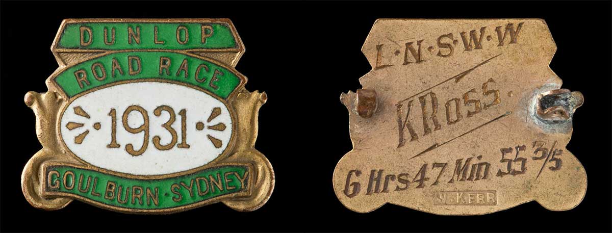 Front and back of a green enamelled metal medal in a shield design. - click to view larger image