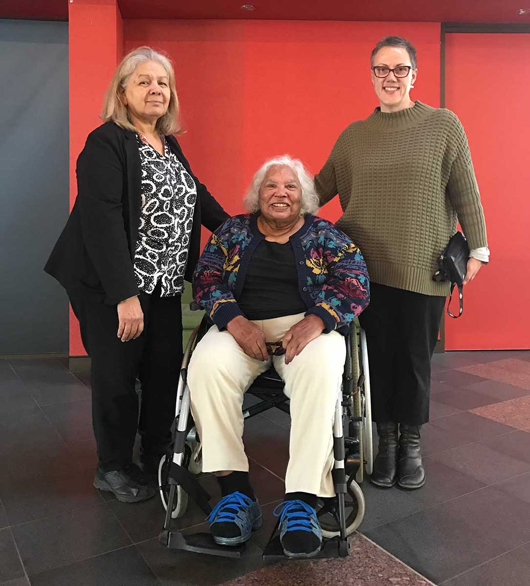 Group shot with three women, one in a wheel chair - click to view larger image