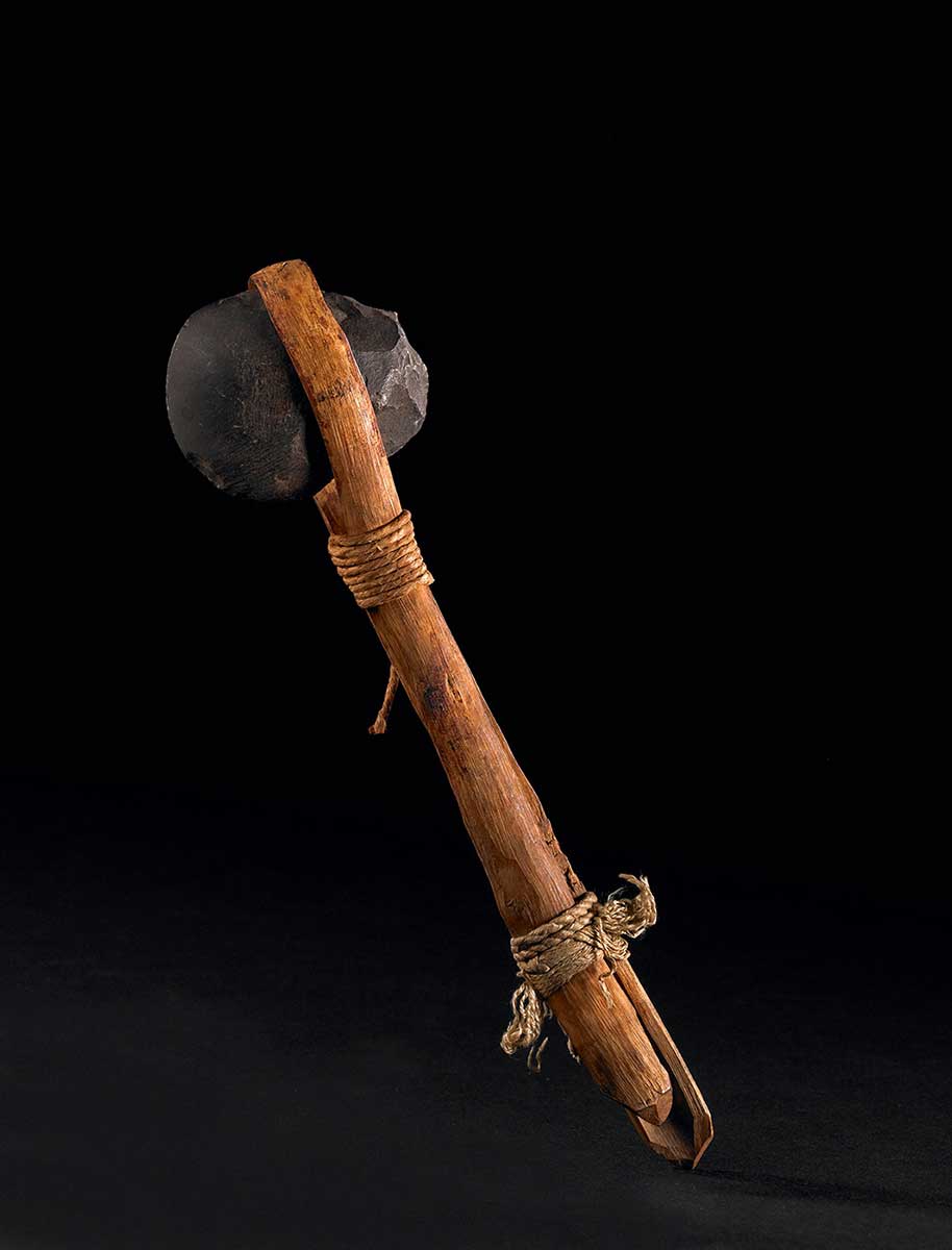 An axe made of stone, wood and rope. - click to view larger image