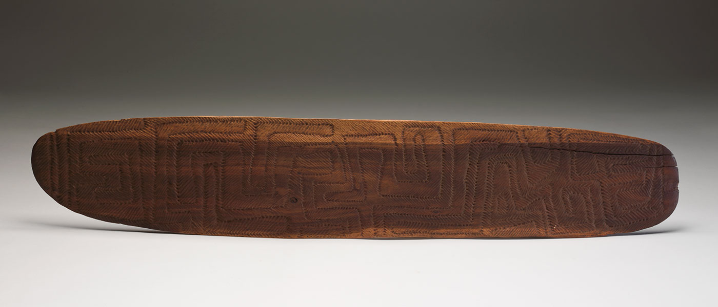 Incised parrying shield 1978 made by Tim Payungka Tjapangarti. - click to view larger image
