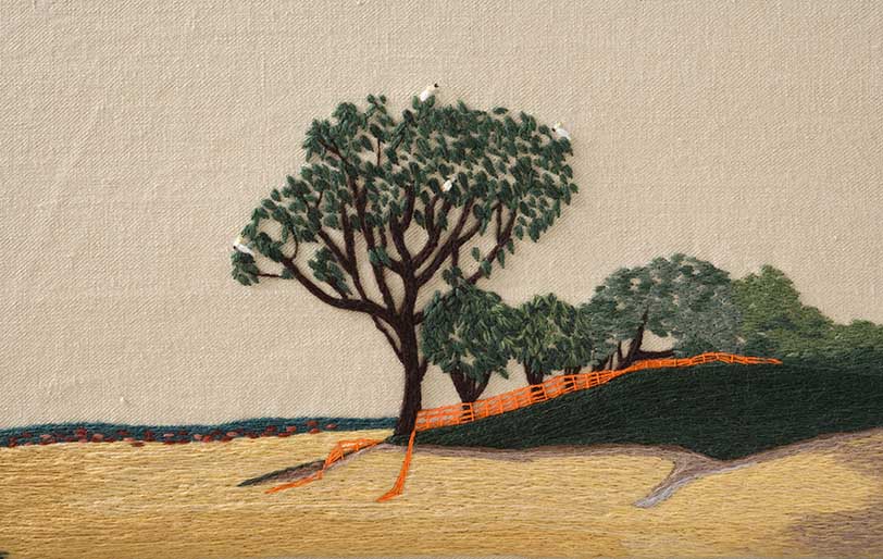 A detail of panel two of 'The Crimson Thread of Kinship' embroidery featuring four white cockatoos sitting in a tree. - click to view larger image