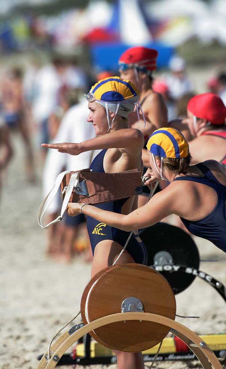 Lifesavers using a surf belt and reel, Australian Surf Life Saving Championships, Kurrawa, Queensland, 2006. - click to view larger image