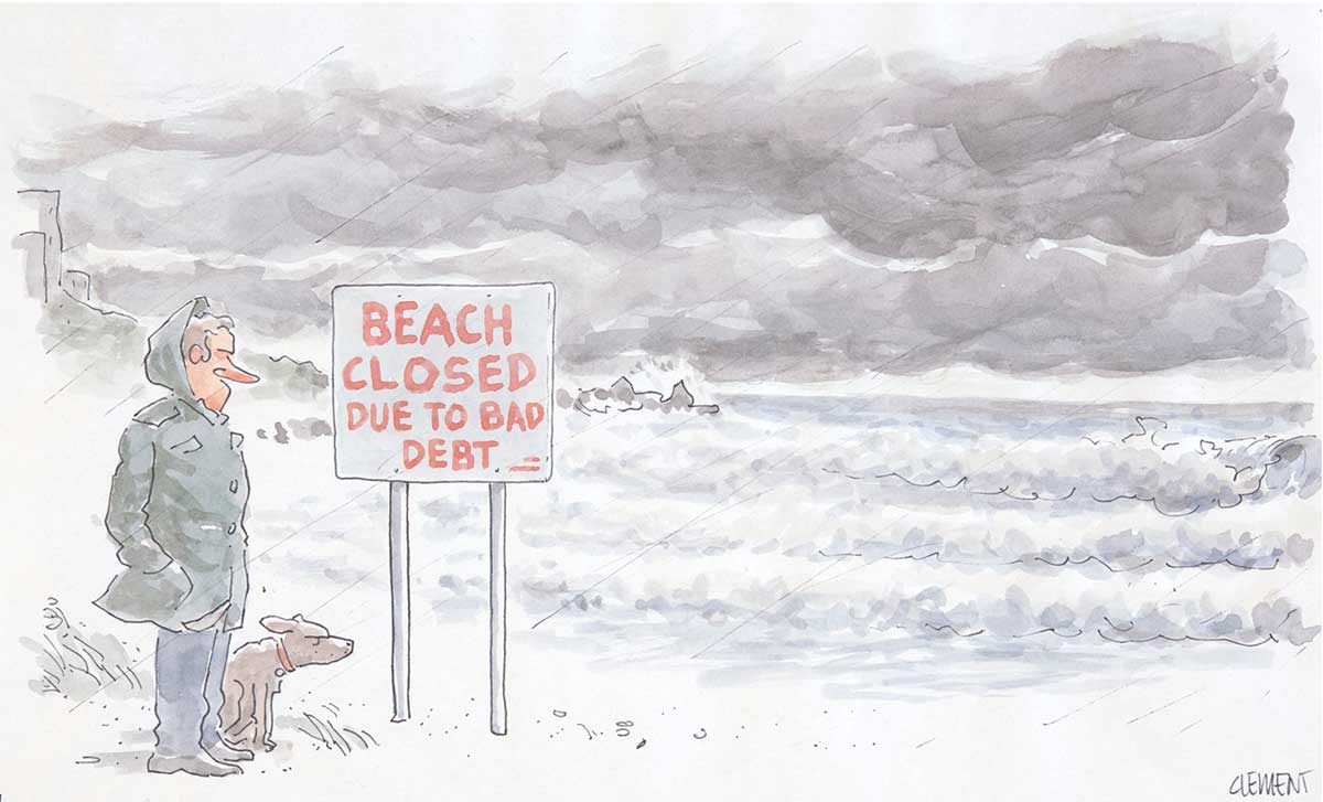 A beach scene. The surf is rough and the sky filled with leaden storm clouds. A headland and rocky point are seen in the left middle distance. In the left foreground stands a man, facing the right side of the image, wearing a hooded raincoat. A dog sits at his left foot, also facing right, its eyes shut and ears blown back in the wind. The man is looking at a sign close by on two poles. The sign says 'Beach closed due to bad debt.' - click to view larger image