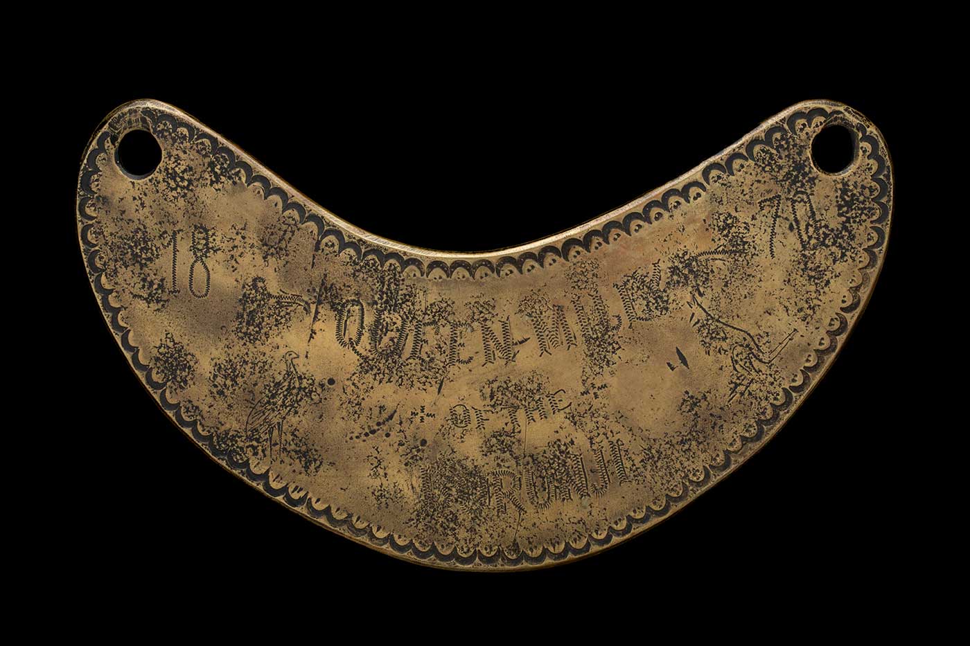 Engraved breastplate with decorative border and a heavily pitted surface. Text '1870' and images of a kangaroo and emu are partially visible. - click to view larger image