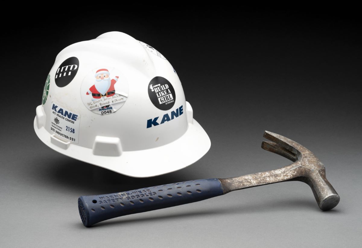 Photo of a steel hammer and hard hat - click to view larger image