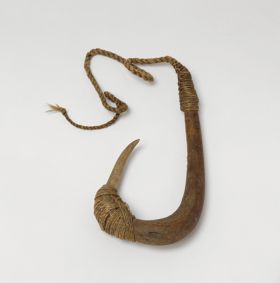 Fishhook with wooden shank, with a bone point lightly curved and lashing at the bone point and upper shank made of plant fibres extending to a twisted cord.