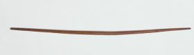 Bow made of brown light wood and slightly curved.