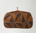 Oval-shaped basket made of coconut fibre and decorated with shells.
