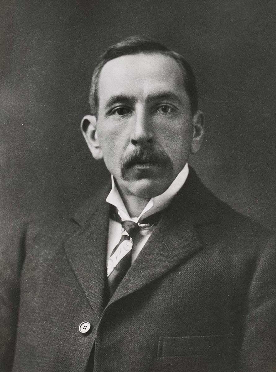 Studio portrait photo of an expressionless Billy Hughes. - click to view larger image