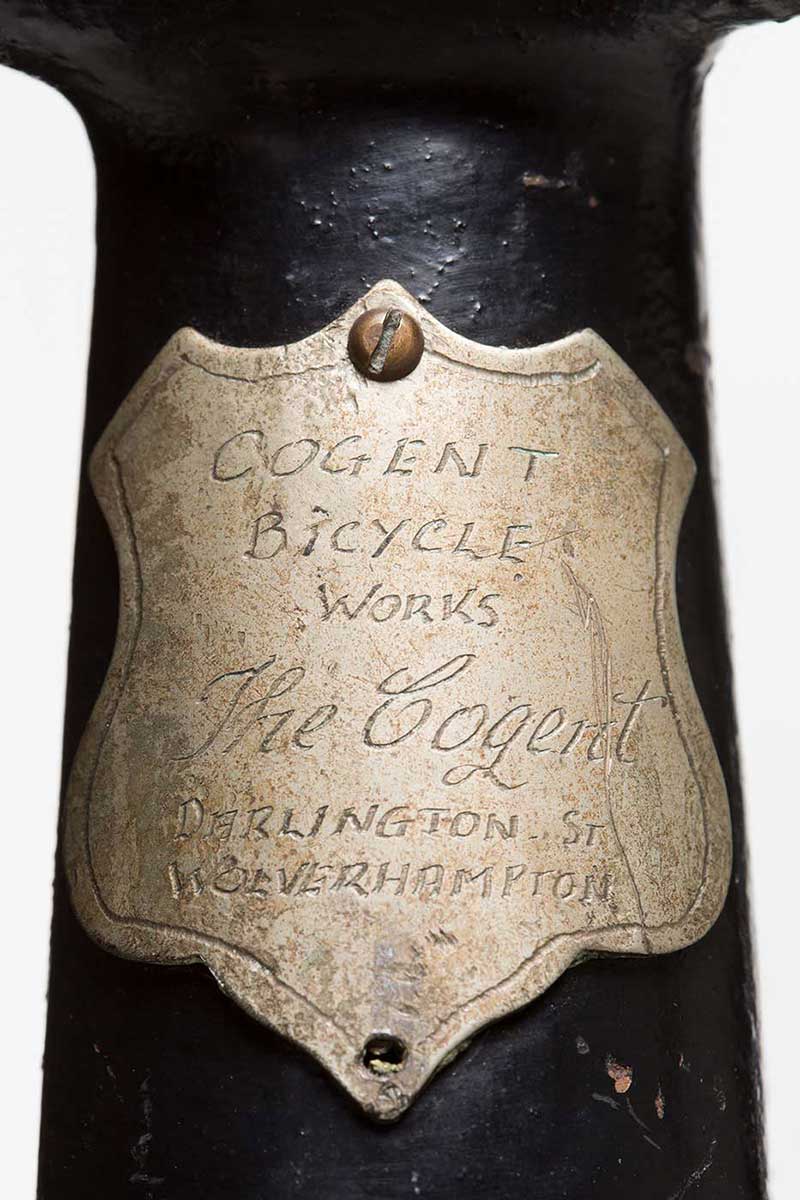 An engraved plaque which reads 'COGENT BICYCLE WORKS / The Cogent / DARLINGTON ST / WOLVERHAMPTON'. - click to view larger image