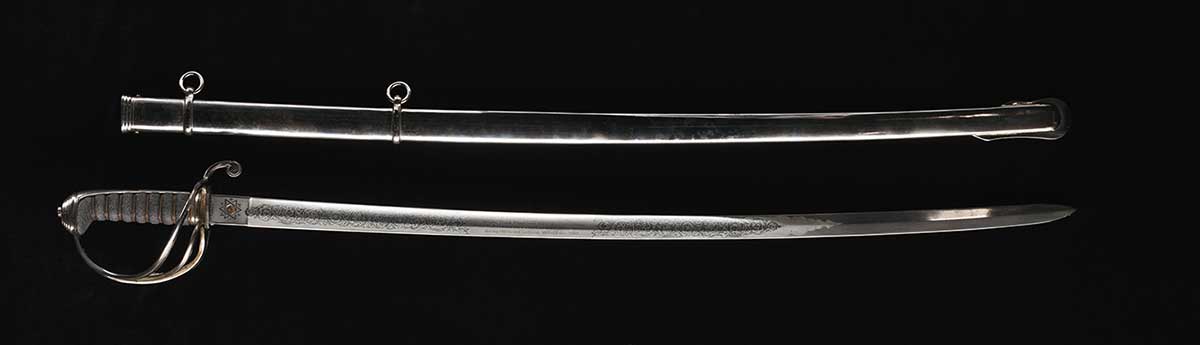A polished steel sword under a grey scabbard.