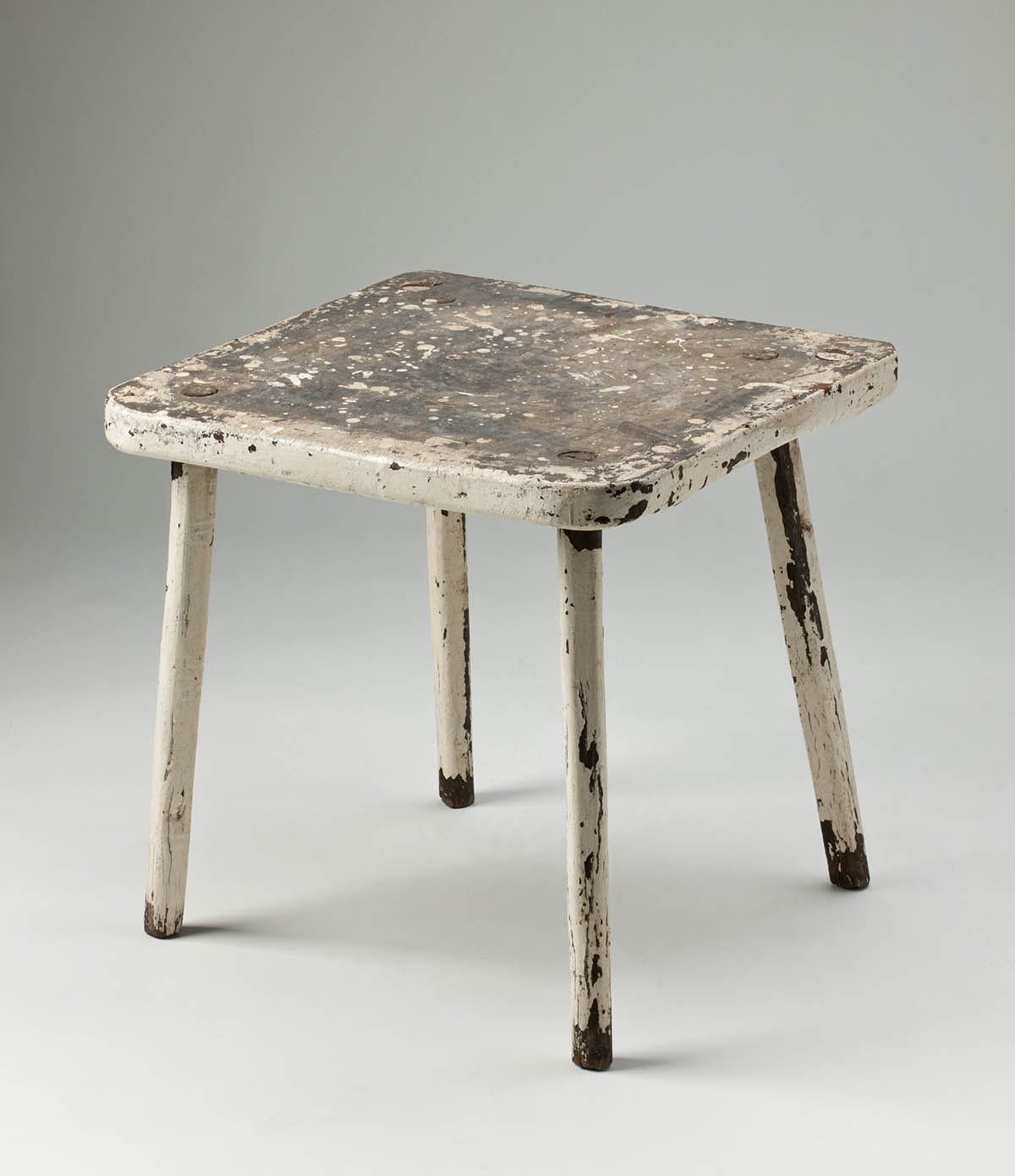 Wooden stool, painted cream, with four legs and a square seat. - click to view larger image