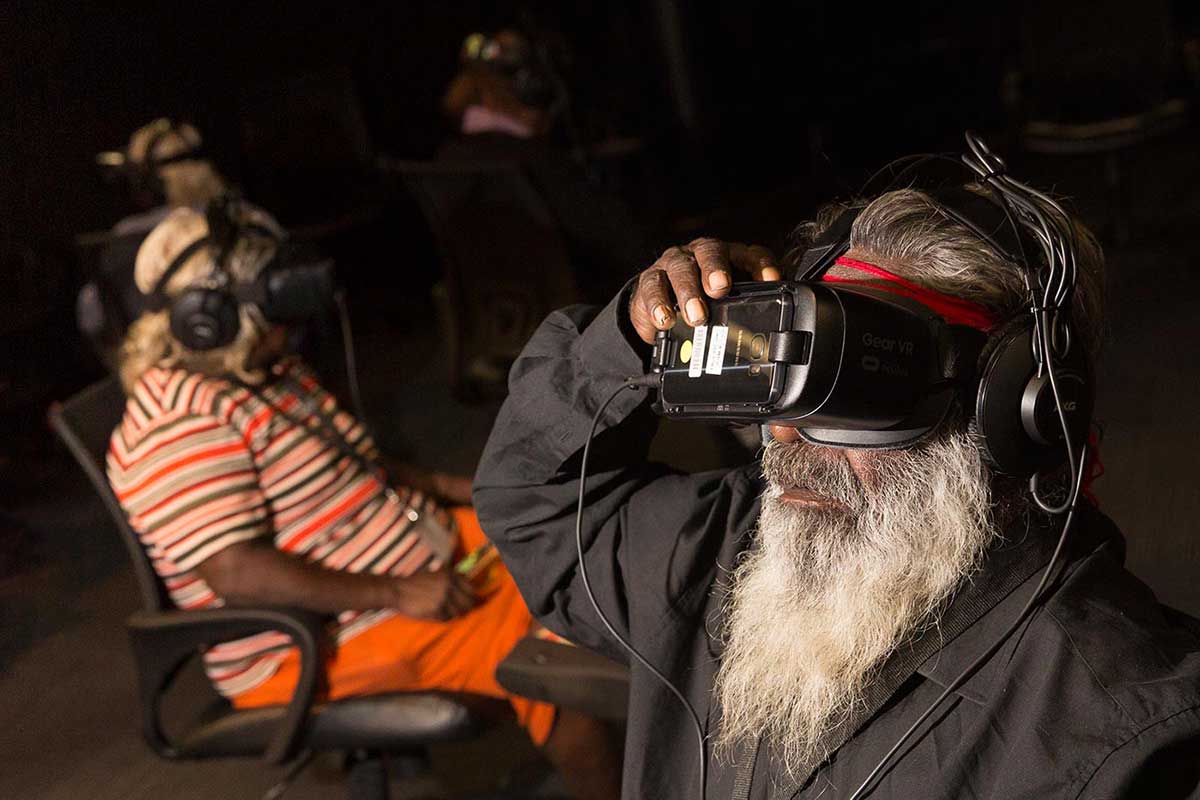 A man with a long white beard enjoys a virtual-reality experience.