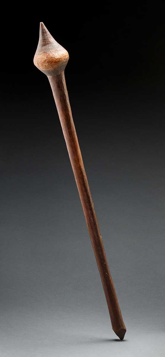 A cylindrical wooden club, with a bulbous head ending in a point. - click to view larger image